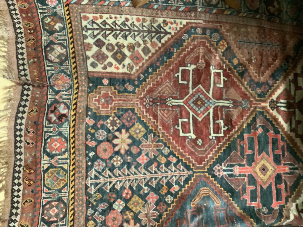 A Caucasian black ground rug, 237 x 159cm